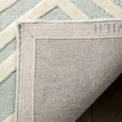 Safavieh Kids SFK910 Hand Tufted Area Rug - Safavieh -Children Furniture Store GUEST f320feed 6e60 4952 96ce bfe3189f733d