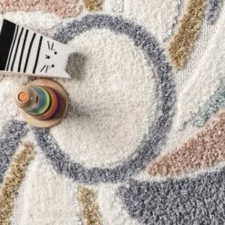 Theodora Colorful Swirl Kids Tassel Area Rug 15 Theodora Colorful Swirl Kids Tassel Area Rug -Children Furniture Store GUEST fcf6084c b223 49a0 95d2 c926dd45af18